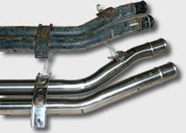 Stainless Steel coolant pipes pictured next to rusty original pipes